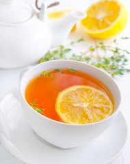 Fresh tea with lemon in the white cup