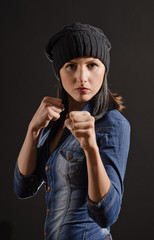 Portrait of young woman ready to fight