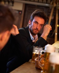 Young businessman drunk in pub