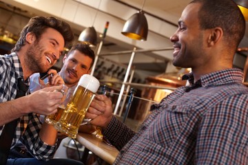 Friends drinking in pub