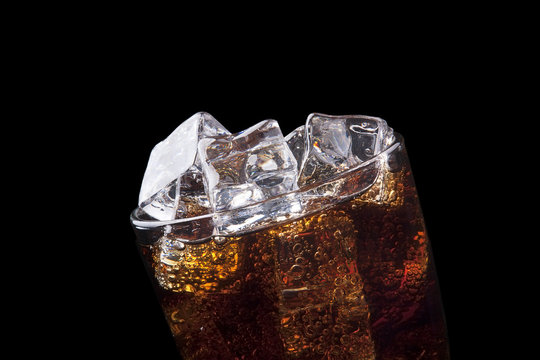 Fresh cola drink background with ice