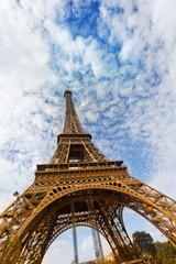 Fototapeta na wymiar Eiffel Tower against the blue sky and clouds. Paris. France.