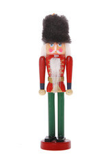 Traditional Figurine Christmas Nutcracker Wearing A Old Military Style Uniform isolated on white background