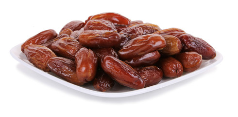 Fresh dates on white plate isolated on white background