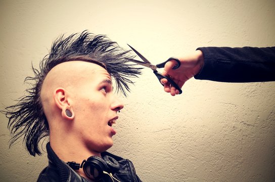 Punk man with mohawk haircut.
