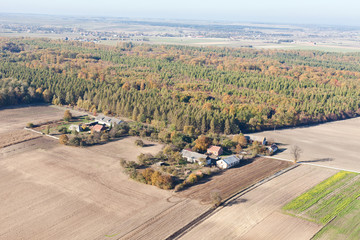 aerial view of harvest fields and forest landscape