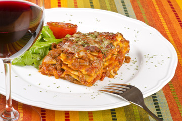 Meat Lasagna and Glass of Red Wine