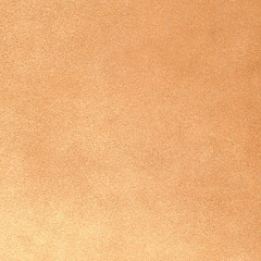 Fototapeta na wymiar Orange leather texture closeup
