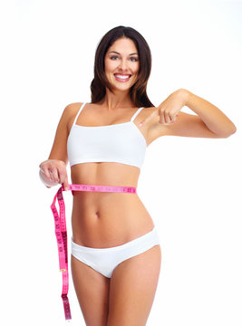 Beautiful healthy woman with a measuring tape.