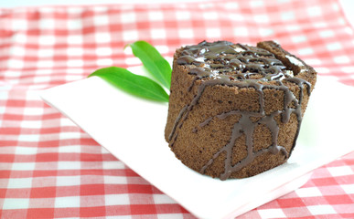 Chocolate roll cake on plate