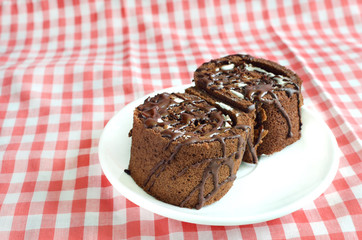 Chocolate roll cake on plate