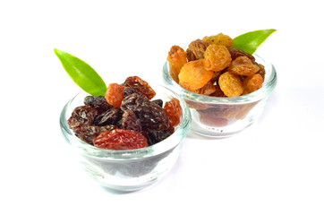 Mix raisins in glass bowl isolated on white