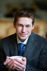 Handsome man with cup of tea