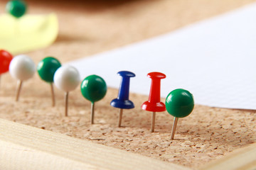 Close up of three push pins