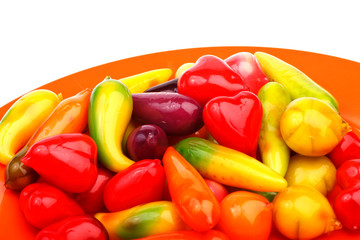 deletable imitation fruits on red plate