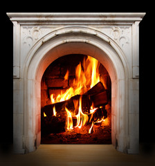 Vintage fireplace with burning logs. Renewable energy concept.