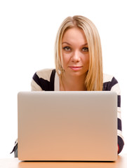 Stylish blonde woman working on a laptop