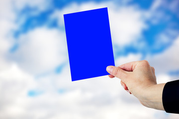 Hand shows Blue Card