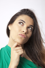 Fototapeta premium real beautiful young girl thinking expression on wihte