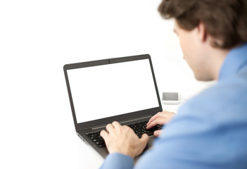 Rear view of business man sitting at office and using laptop