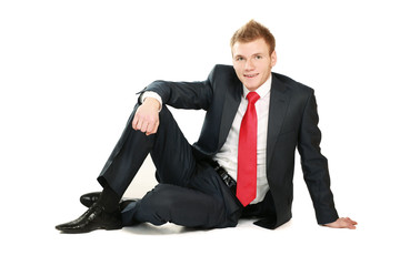 Relaxed mature business man sitting on the floor