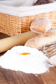 bread, flour, eggs and kitchen utensil