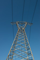 high voltage electrical towers in line