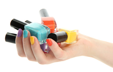 woman hand with nail polishes isolated on white