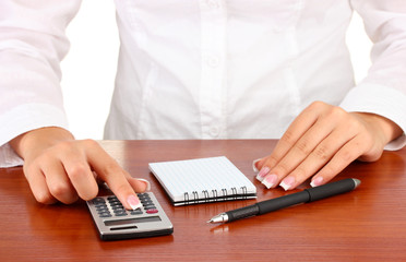 Woman's hands counts on the calculator, close-up