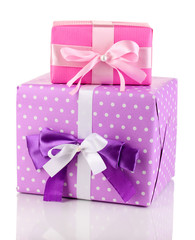 Colorful pink and purple gifts isolated on white
