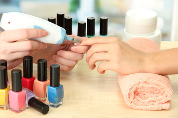 Manicure process in beauty salon, close up