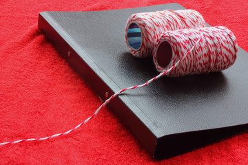 File a document with black string tie.
