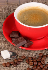 Red cup of Turkish coffee with chocolate, close up