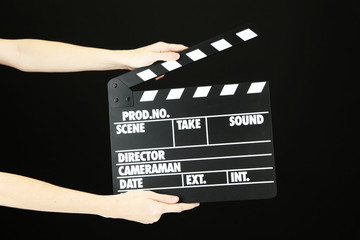 Movie production clapper board isolated on black