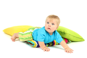 Little boy and color pillows, isolated on white
