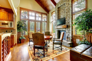 Luxury mountain home diining and living room with fireplace.