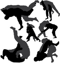 Jiu-jitsu (jujitsu) and judo wrestlers vector silhouettes isolated on white background