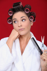 Obraz premium Woman wearing hair rollers