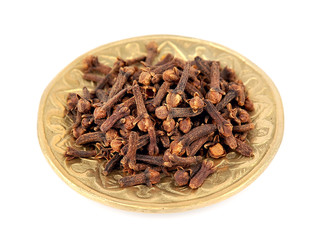 Carnation (spices) in golden plate