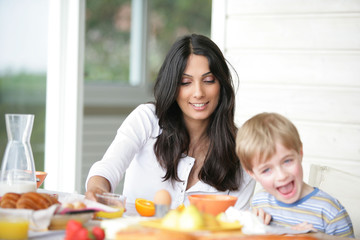 Mother and son at breakfast