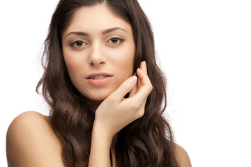 Fototapeta premium Portrait of young beautiful woman with hand