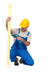 A male carpenter with a drill.