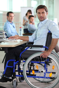 Man in wheelchair on laptop