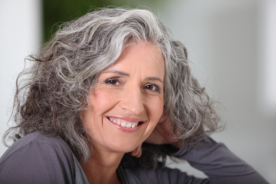 Close-up of grey haired woman at home