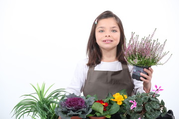 A little girl posing with her plants