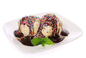 ice cream with chocolate and candy sprinkles topping,\