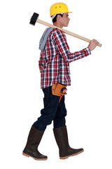 Man carrying sledge-hammer