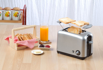 Fototapeta na wymiar Bread toaster the kitchenware you need for preparing breakfast