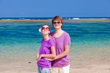 Fototapeta na wymiar young beautiful couple on tropical bali beach.honeymoon