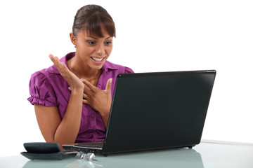 Happy woman at the computer